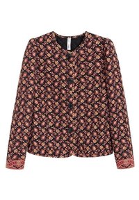 Veste noire boutonnée à manches longues, couverte de petits motifs floraux roses et jaunes et poignets décoratifs.