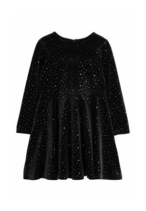 Vestito nero a maniche lunghe con pois argentati e gonna a campana, realizzato in morbido tessuto in velluto.