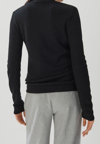 someday. Stickad tröja - black