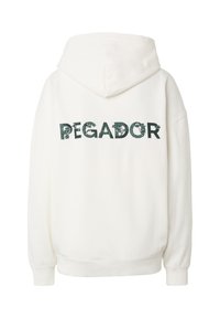 Felpa bianca con cappuccio, con la scritta "PEGADOR" in verde scuro con motivi di foglie sulla schiena.