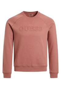 Sweatshirt i hindbærfarve med rund hals, ribbede manchetter og et tekstureret "GUESS"-logo på fronten. Fremstillet af blødt bomuldsstof.