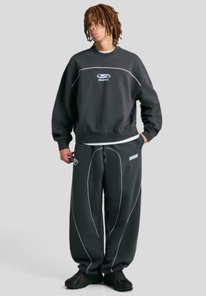 BALLOON FIT PRINTED - Träningsbyxor - mottled dark green