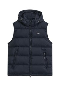 Marineblauer Steppweste mit Kapuze, ausgestattet mit einem durchgehenden Reißverschluss, zwei seitlichen Taschen und einem gesteppten Design zur Isolierung. Leicht und warm.