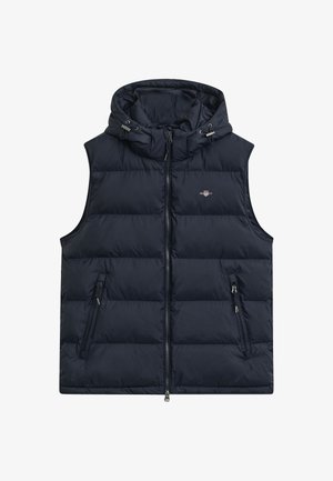 Tumesin puffer-vest, millel on kapuuts, täislukk ja kaks külje taskut, samuti on sellel soojustuseks teppimine. Kerge ja soe.