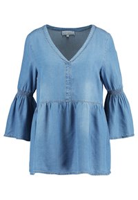 Light blue denim top with a V-neck, flared long sleeves, gathered cuffs, and a peplum waist. Smooth texture with unhemmed edges.