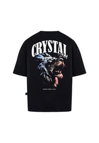 Černé bavlněné tričko s velkým grafickým motivem lví hlavy a textem "CRYSTAL Paris" vyvedeným tučným písmem na zadní straně.