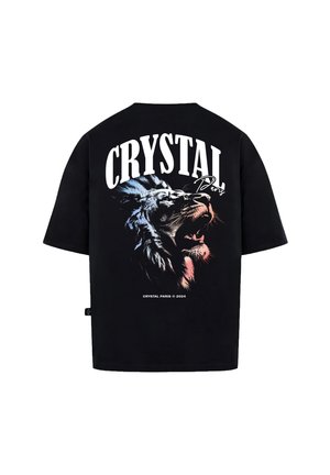 Černé bavlněné tričko s velkým grafickým motivem lví hlavy a textem "CRYSTAL Paris" vyvedeným tučným písmem na zadní straně.