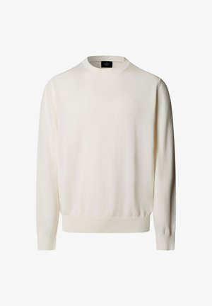 Pull à manches longues couleur crème avec col rond, poignets et ourlet côtelés, arborant un petit logo brodé sur la poitrine.