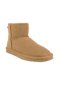 Stivale alla caviglia in sheepskin marrone con una texture liscia, punta rotonda e dettagli di cucitura. Presenta una suola in gomma per una buona aderenza.