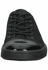 Black lace-up shoes featuring a smooth, glossy patent leather toe cap and a textured fabric upper. Rubber sole with slight tread.