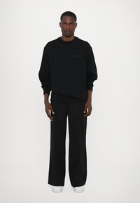 Les Benjamins Παντελόνι φόρμας - black