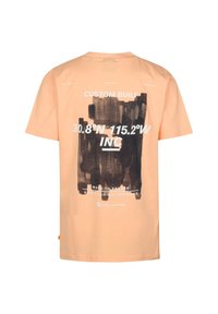 T-shirt en coton couleur pêche avec un grand imprimé graphique noir au dos, texte blanc et coordonnées, manches courtes et coupe décontractée.