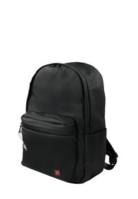 Black backpack with a front zippered pocket, side pockets, padded straps, and a small red and black logo on the front pocket.