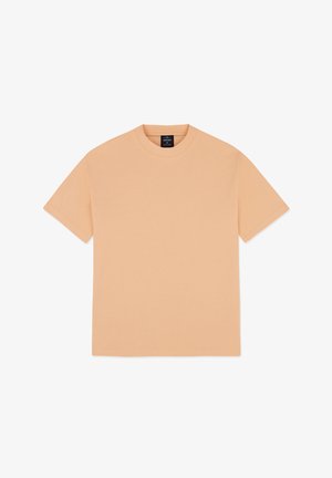 Pfirsichfarbiges Baumwoll-T-Shirt mit kurzen Ärmeln, rundem Halsausschnitt und geradem Schnitt, das eine glatte Textur aufweist und keine sichtbaren Muster hat.