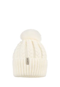Cream-colored knitted winter hat with cable pattern, folded cuff, fluffy pom-pom on top, and a small fabric brand label on the front.