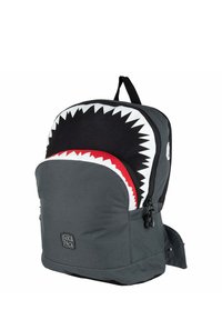 Backpack with shark design, black and gray fabric, white teeth pattern, red accents, front zip pocket, adjustable shoulder straps, durable material.
