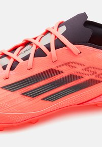 adidas Performance Nogometne kopačke za čvrstu podlogu - turbo/aurora black/platin metallic
