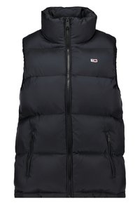 Czarna kamizelka puchowa z wysokim kołnierzem, na zamek z przodu oraz dwiema kieszeniami po bokach. Zawiera małe logo na lewej części klatki piersiowej. Gładka tekstura.
