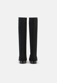 Knee-high black fabric boots with a smooth finish, sturdy heel, and seam detailing along the back. Designed for a snug fit.