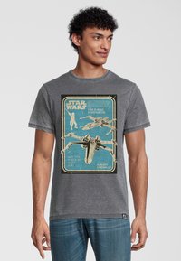 Gray cotton t-shirt featuring a vintage-style illustration of an X-Wing starfighter with blue background and white text.