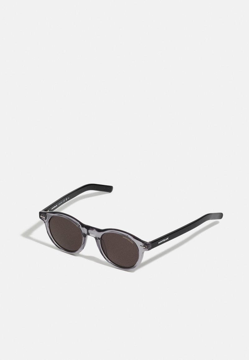 Round-framed sunglasses with dark lenses, translucent gray front frame, and black temples branded Montblanc, on a white background.