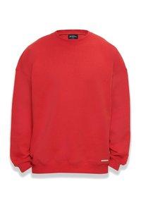Roter Sweatshirt mit Rundhalsausschnitt, langen Ärmeln, gerippten Bündchen und Saum. Mit einem kleinen Logolabel am unteren linken Rand in der Nähe des Saums.