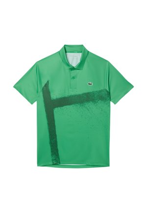 Grünes Poloshirt aus glattem Stoff mit einem auffälligen schwarzen Grafikdesign. Verfügt über einen Kragen, zwei Knöpfe und ein kleines Logo auf der Brust.