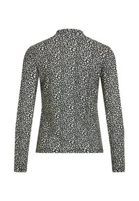 T-shirt à manches longues en noir et crème avec un motif à pois varié, doté d'un col haut et d'une texture de tissu douce.