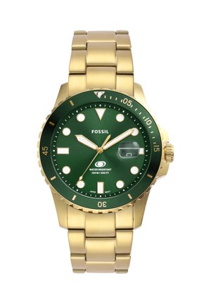 Goldene Metallarmbanduhr mit grünem Zifferblatt, leuchtenden Stundenmarkierungen, drehbarer Lünette, Datumsvergrößerung und Wasserbeständigkeit bis zu 100 Metern.