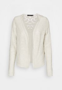 Vit texturerad cardigan med långa ärmar, öppen framsida och blommig spetsdetalj vid halsringningen. Stickad tyg med en mjuk, avslappnad design.