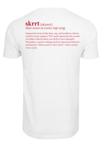 White cotton t-shirt featuring red text on the back. The text defines "skrrt" and includes a description in multiple lines.