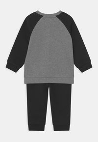Puma MINICATS RAGLAN SET - Träningsset - black