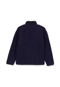 Chaqueta de forro polar azul marino con un cuello alto y una superficie texturizada. Presenta mangas largas y un ajuste holgado, sin hardware ni acentos visibles.