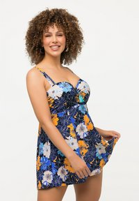 Blumenbadekleid in Marineblau mit lebhaften blauen, orangen und weißen Blumen. Verfügt über verstellbare Träger, geraffte Büste und ausgestellten Saum.