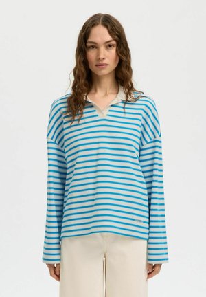 Blauw- en crèmekleurig gestreept poloshirt met lange mouwen, een V-hals en een losse pasvorm. Gemaakt van lichtgewicht stof, met een subtiel logoaccent.