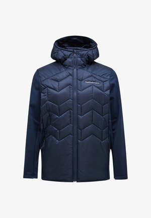 Chaqueta con capucha en color azul marino, con un frente acolchado que presenta un patrón en forma de chevron, cierre de cremallera y mangas sólidas fabricadas con material elástico.