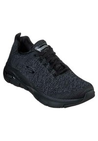 Zapatilla atlética negra con parte superior de punto texturizado, diseño de cordones y suela acolchada con marca en la lengua y el lateral.
