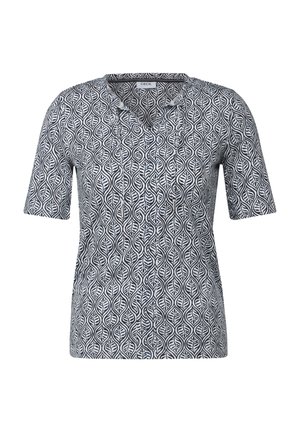 Short-sleeve blouse in a black and white leaf pattern, featuring a V-neck design and smooth fabric texture.