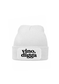 White knit beanie with a ribbed texture and a folded cuff. Features a rectangular patch with the text "vino, digga" in bold black font.