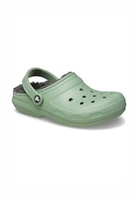 Green rubber clogs with a textured surface, open back, and gray fuzzy lining. Features ventilation holes and a logo on the side.
