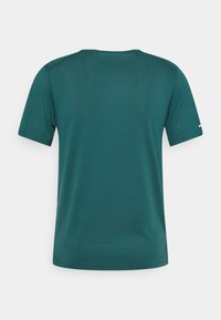 Teal short-sleeve T-shirt made of breathable fabric with a subtle mesh texture. Features a crew neck and a small logo on the left sleeve.