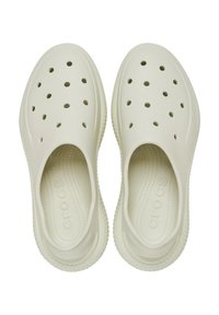 White slip-on shoes made of lightweight material with ventilation holes, a textured sole, and embossed logo on the footbed.