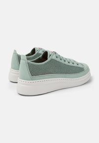 Light teal sneakers featuring a mesh upper, suede accents, and a thick white sole with stitching details. Classic lace-up design visible.