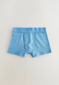 Boxers courts bleu clair en tissu doux, avec une ceinture texturée portant l'inscription "NEXT" en relief. Le design comprend une coupe classique à jambes courtes.
