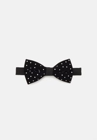 Schwarze Samtfliege mit weißen Polka-Dots, ausgestattet mit einem zentralen schwarzen Band und einer durchgängig glatten Satin-Oberfläche.