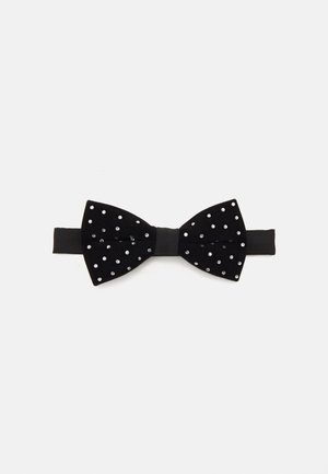 Papillon in velluto nero con pois bianchi, caratterizzato da una fascia centrale nera e una superficie liscia in satin.