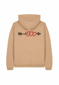 Felpa beige con cappuccio e maniche lunghe. Sul retro presenta cuori ricamati rossi e neri incrociati da un design a freccia. Texture morbida.