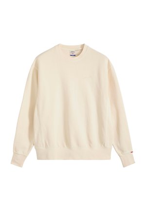 Beżowa bluza z długim rękawem i okrągłym dekoltem, z ściągaczami przy mankietach i dolnym brzegu, z małym haftem logo na piersi oraz czerwonym oznaczeniem na mankiecie lewego rękawa.