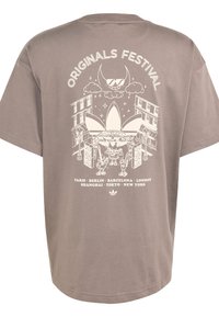 Brown cotton t-shirt featuring a large white graphic design on the back with a festival theme and city names listed below.