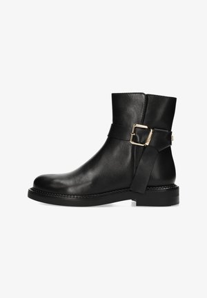 Black leather ankle boot with a rounded toe, side buckle detail, smooth texture, and a low, chunky heel. Features a stitched sole.